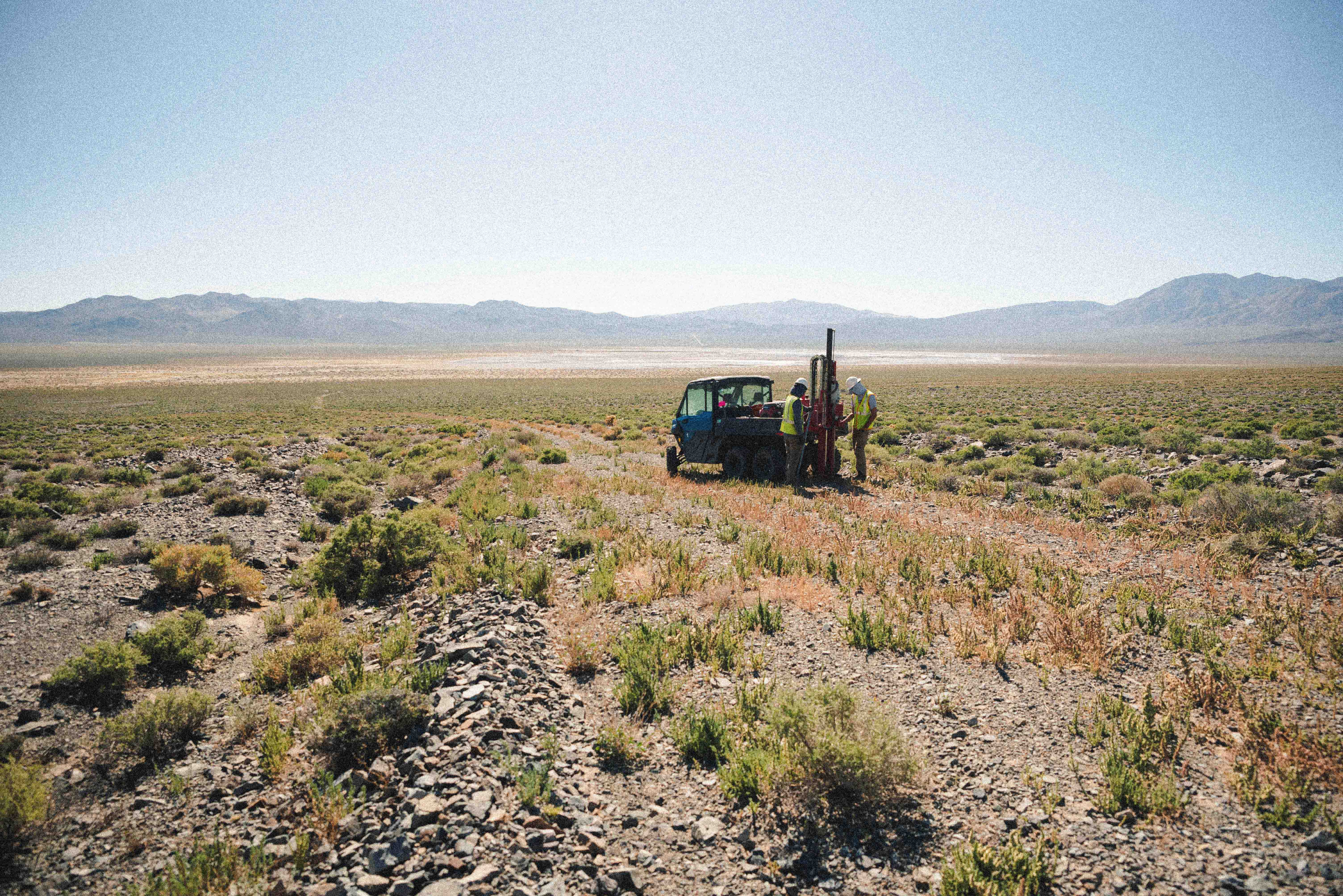 A desert landscape is faded as a background.