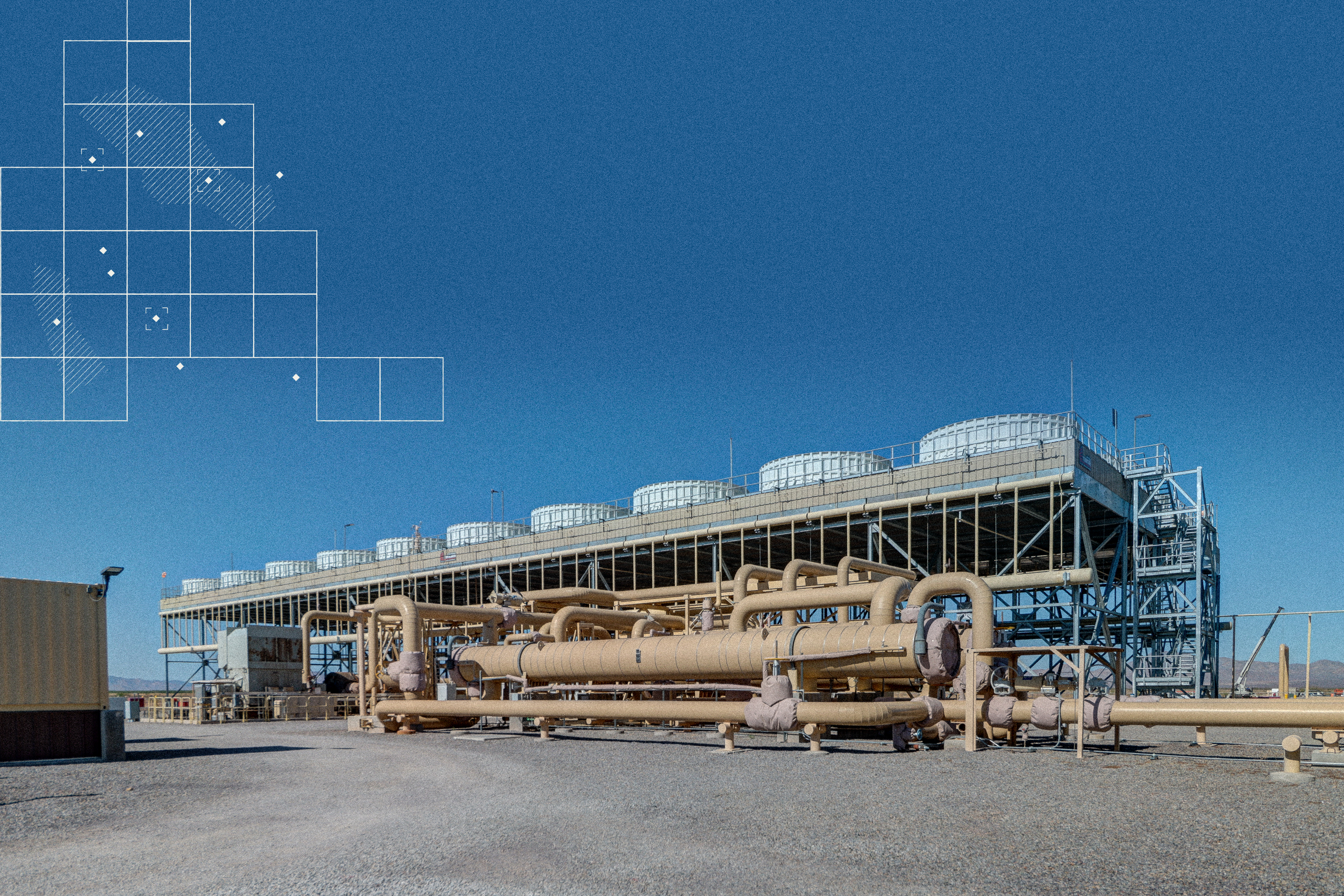 Lightning Dock Geothermal Power Plant in New Mexico, shown against a clear blue desert sky. Large beige pipes run along the ground, connecting to a raised steel structure topped with cooling towers. A subtle white grid overlay in the sky suggests data and mapping. The scene highlights industrial scale, clean energy, and geothermal innovation.